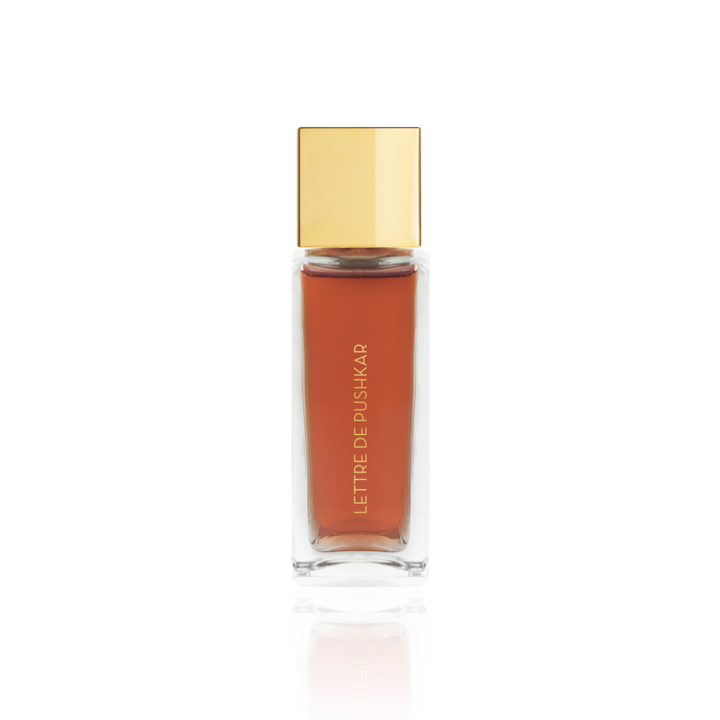 Flacon de parfum Lettre de Pushkar d’Ella K avec capuchon doré, présenté de côté sur fond blanc.